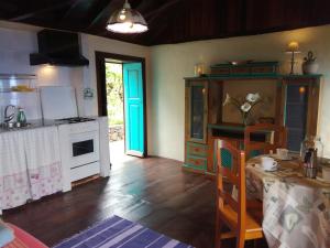 a kitchen with a table and a stove top oven at Casas las Gemelas VIEWPOINT! in Garafía