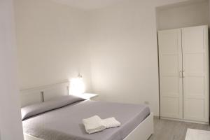 Ένα ή περισσότερα κρεβάτια σε δωμάτιο στο Casa vacanze Cortile Barocco