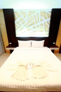 Intara Resort tesisinde bir odada yatak veya yataklar