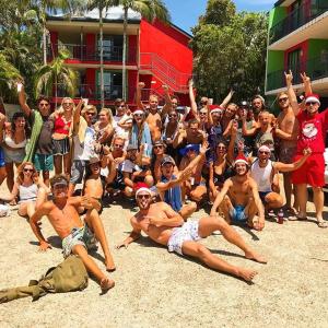 
a large group of people are gathered around a fire hydrant at Beach Hostel Mooloolaba in Mooloolaba
