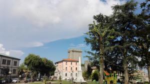a building in a city with a mountain in the background at La Casa di Mà in Piancastagnaio +26 photos