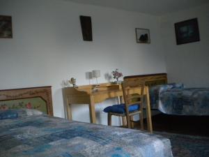 A bed or beds in a room at B&B DOLOMIA