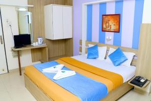 Кровать или кровати в номере Hotel Alka Residency