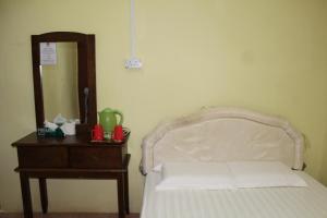 Łóżko lub łóżka w pokoju w obiekcie Liwagu Lodge