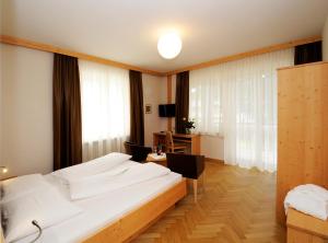Postel nebo postele na pokoji v ubytování Hotel Jasmin
