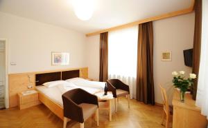 Postel nebo postele na pokoji v ubytování Hotel Jasmin
