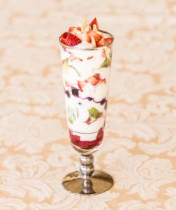 a dessert glass with fruit and whipped cream at The Block Vista B&B in Nanango