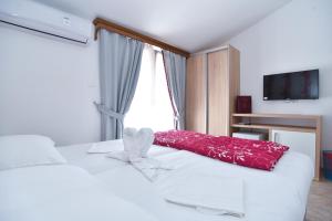 Postel nebo postele na pokoji v ubytování Hotel Grbalj