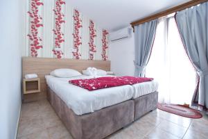 Postel nebo postele na pokoji v ubytování Hotel Grbalj