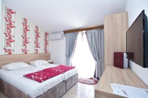 Postel nebo postele na pokoji v ubytování Hotel Grbalj