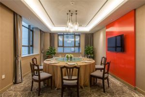 Uma televisão e/ou sistema de entretenimento em Wuhan Hongguang Hotel