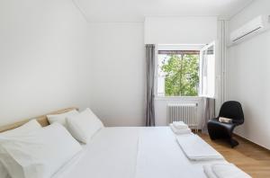 Postel nebo postele na pokoji v ubytování Likavittos Apartments