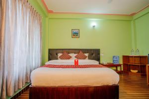 Łóżko lub łóżka w pokoju w obiekcie Hotel Glory Garden