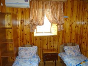 Guesthouse on Pushkina 10房間的床