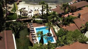 an overhead view of a resort with a swimming pool and a beach at Baga Hotel in Akyaka