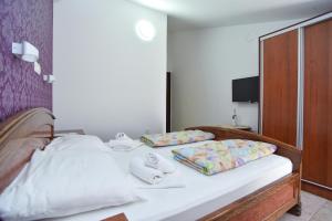 Postel nebo postele na pokoji v ubytování Hotel Grbalj