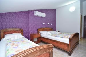 Postel nebo postele na pokoji v ubytování Hotel Grbalj