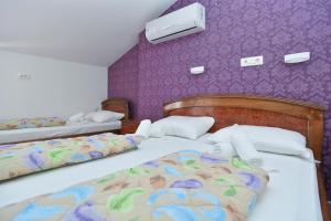 Postel nebo postele na pokoji v ubytování Hotel Grbalj