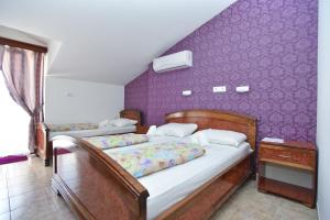 Postel nebo postele na pokoji v ubytování Hotel Grbalj