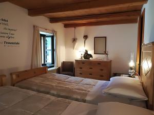 Llit o llits en una habitació de Albergo Pa' Krhaizar