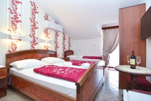 Postel nebo postele na pokoji v ubytování Hotel Grbalj