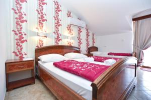 Postel nebo postele na pokoji v ubytování Hotel Grbalj