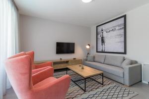 Televízia a/alebo spoločenská miestnosť v ubytovaní Luxury Apartments Magali 2