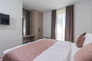 Posteľ alebo postele v izbe v ubytovaní Luxury Apartments Magali 2