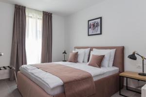 Posteľ alebo postele v izbe v ubytovaní Luxury Apartments Magali 2