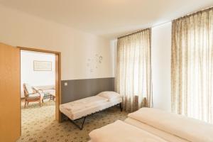 Letto o letti in una camera di Hotel Markgraf Leipzig
