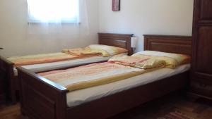 Postel nebo postele na pokoji v ubytování Apartmani Luja