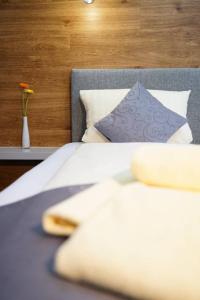 Postel nebo postele na pokoji v ubytování CREO Munich City