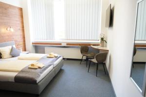 Postel nebo postele na pokoji v ubytování CREO Munich City