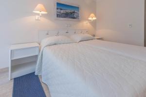 Łóżko lub łóżka w pokoju w obiekcie Hotel Bryza Resort & Spa