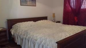 Postel nebo postele na pokoji v ubytování Apartmani Luja