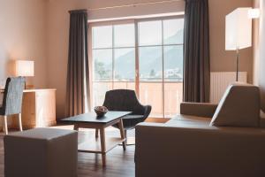 Hotel Tiefenbrunn Gardensuites & Breakfast的休息区