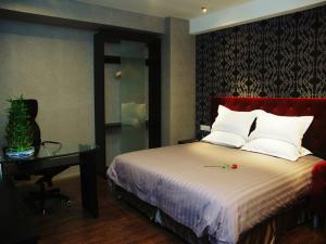 Cama o camas de una habitación en 桔子水晶苏州观前街酒店