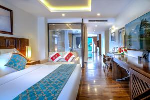 Postel nebo postele na pokoji v ubytování Sapa Relax Hotel & Spa