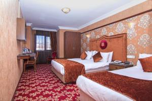 A bed or beds in a room at Antea Palace Hotel & Spa