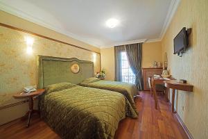 A bed or beds in a room at Antea Palace Hotel & Spa