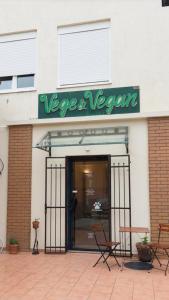 a store with a sign that reads vegas vegan at Vege & Vegan Restaurant and Accommodation in Novi Sad