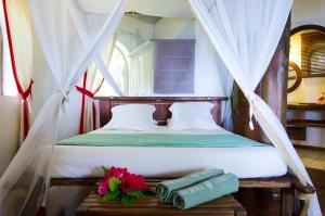 Un ou plusieurs lits dans un hébergement de l'établissement Princesse Bora Lodge & Spa