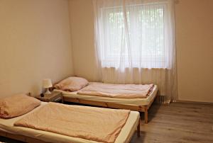Voodi või voodid majutusasutuse Muskat toas