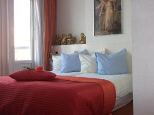 Een bed of bedden in een kamer bij Hotel Hoogland Zandvoort aan Zee