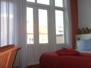 Ein Bett oder Betten in einem Zimmer der Unterkunft Hotel Hoogland Zandvoort aan Zee