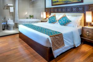 Postel nebo postele na pokoji v ubytování Sapa Relax Hotel & Spa
