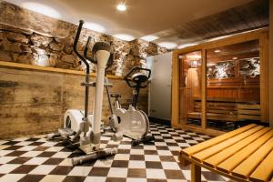 a room with two exercise bikes on a checkered floor at Aparthotel Arai 4* Superior in Barcelona