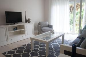 TV a/nebo společenská místnost v ubytování Lavaderos Suites