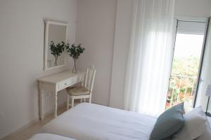 Postel nebo postele na pokoji v ubytování Lavaderos Suites