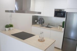 Kuchyň nebo kuchyňský kout v ubytování Lavaderos Suites